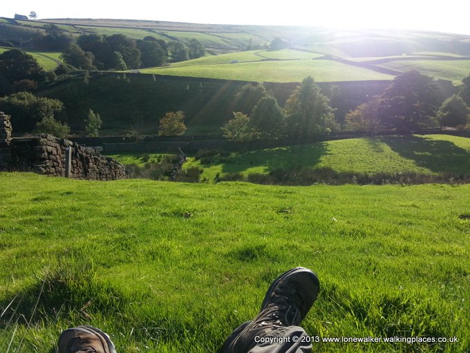 Feet up, catching the sun, on the ascent out of Ponden