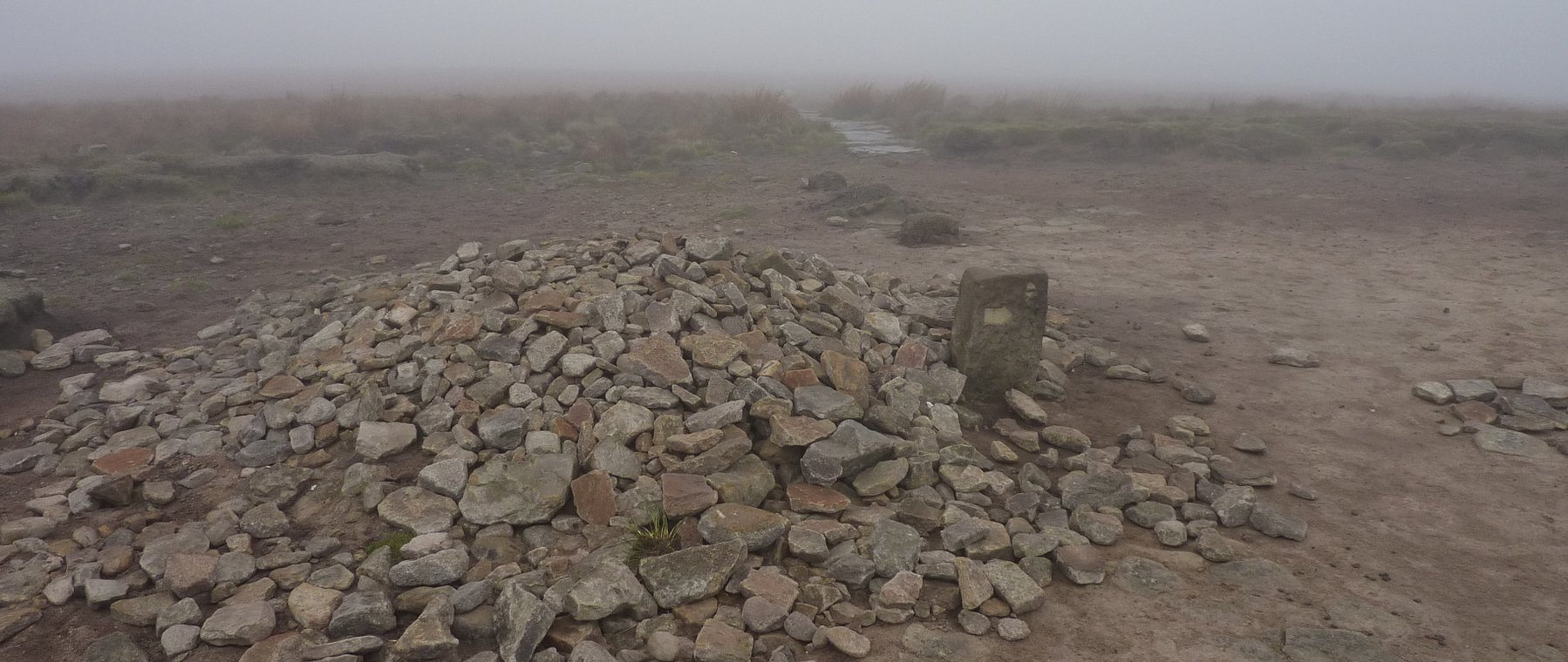 Large cairn marks the junction at Mill Hill