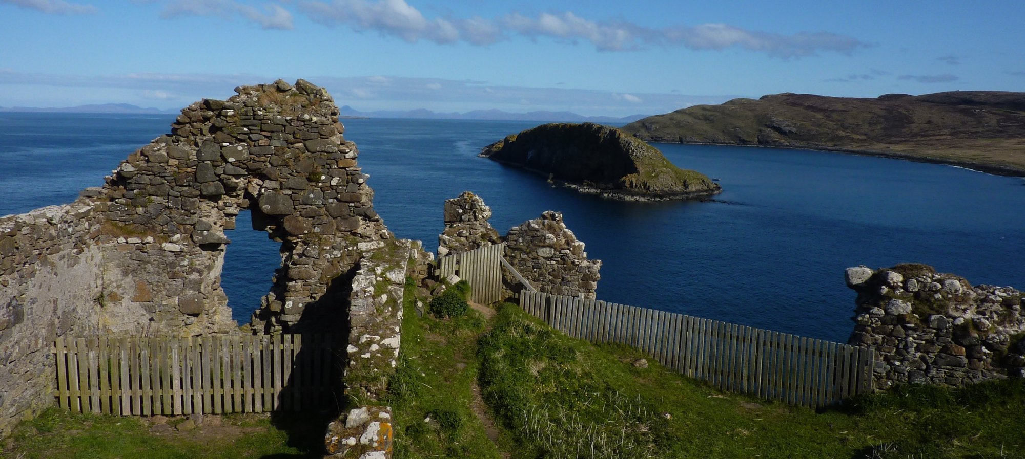 Looking across the broken remains of Duntulm Castle towards Harris and Lewis